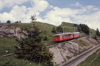 Between Rigi-Staffel and Rigi-Kulm, Vitznau-Rigi Railway (VRB) Bhe 2/4 railcar No. 3 with a trailer car (1975)