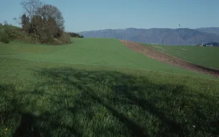 Risch ZG, On golf course southeast of Holzhäusern with the Kathrinenhof, in the background the Zugerberg, Buonas and Rigi (30.03.1994)