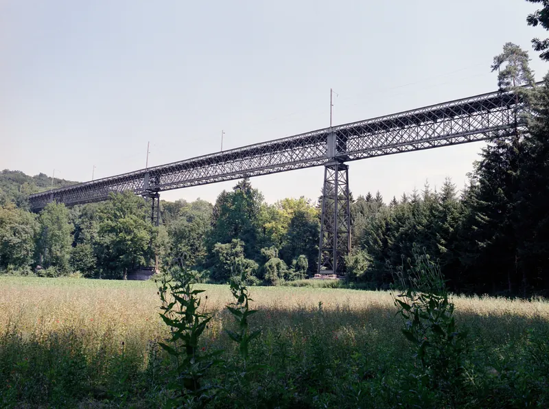 Railroad bridge at Ossingen (over the river Thur): 1: train 7955 at 14:33 from Winterthur, S 29 without lateral sun ; 2: train 7958 at 15:25 to Winterthur, S 29 with lateral sun ; 3: train 7959 at 15:33 from Winterthur, S 29 with lateral sun ; Chräbel in Goldau with Rigi steam loco 17 and BDhe 4/4 15 and driving trailer Bt 25 on downhill at 09:45 (25.07.2001-02.08.2001)