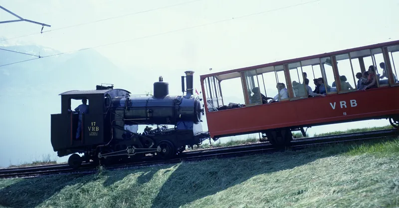 Vitznau-Rigi Railway (VRB), H2/3 steam locomotive No. 17 with passenger car No. 15 on an open stretch of track (ca. 1975)