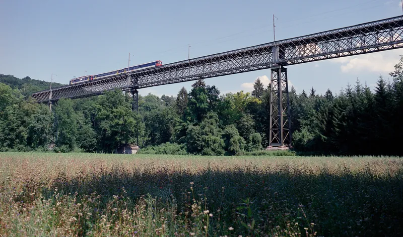Railroad bridge at Ossingen (over the river Thur): 1: train 7955 at 14:33 from Winterthur, S 29 without lateral sun ; 2: train 7958 at 15:25 to Winterthur, S 29 with lateral sun ; 3: train 7959 at 15:33 from Winterthur, S 29 with lateral sun ; Chräbel in Goldau with Rigi steam loco 17 and BDhe 4/4 15 and driving trailer Bt 25 on downhill at 09:45 (25.07.2001-02.08.2001)