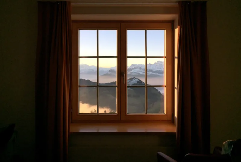 View on the Swiss Alps through a window from Rigi Kulm near Lucerne
