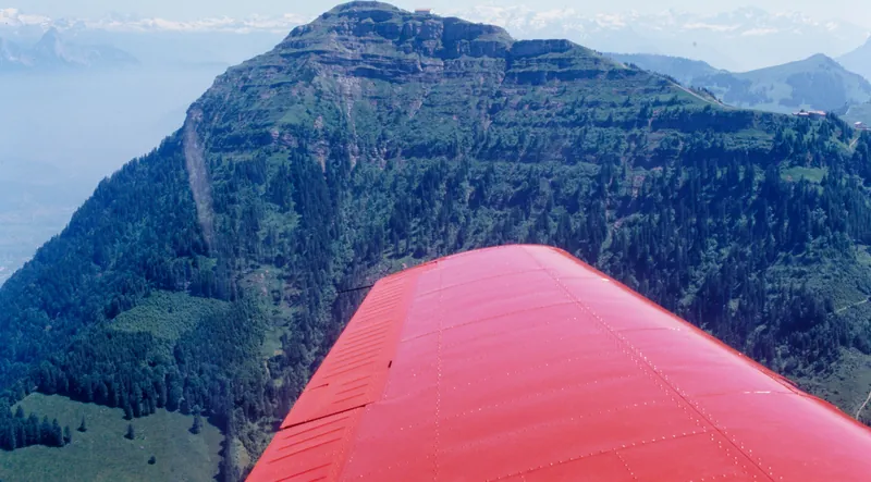 Piaggio of the Swiss Air Traffic School (SLS) in flight in front of Rigi Kulm above Küssnacht am Rigi, looking east-southeast (ESE) (7/1986)