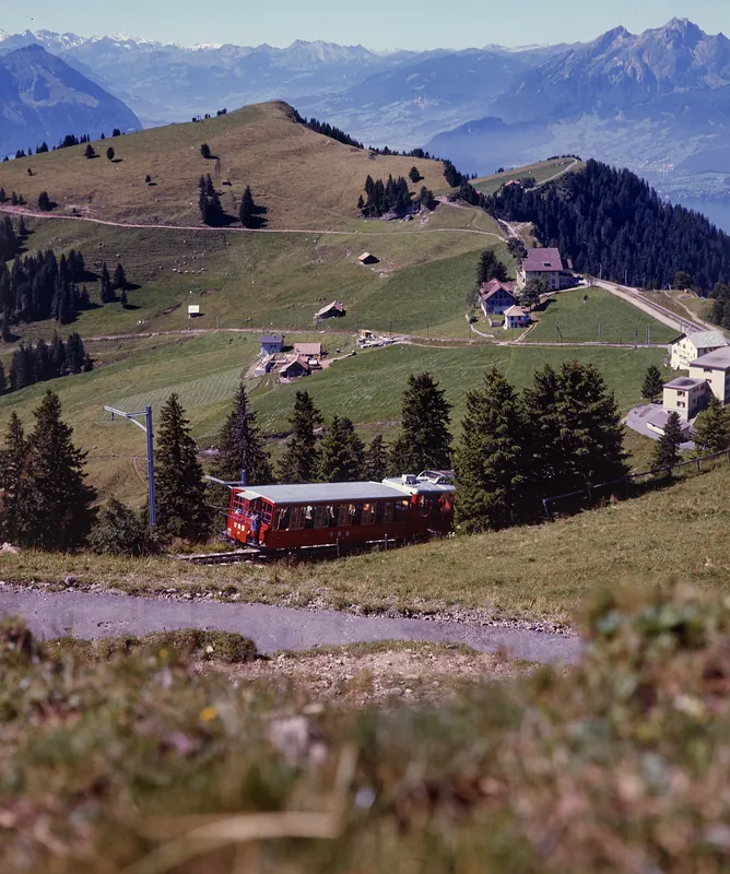 Between Rigi-Staffel and Rigi-Kulm, Vitznau-Rigi Railway (VRB) Bhe 2/4 railcar with a lead car (1975)