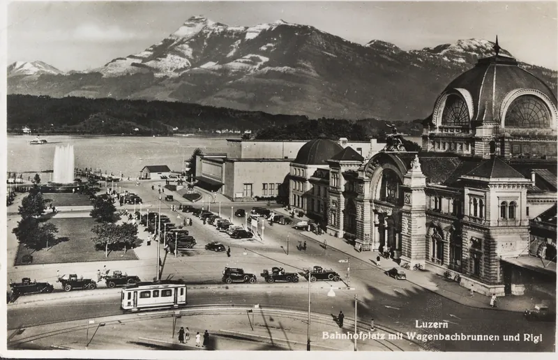 Lucerne, train station square with Wagenbach fountain and Rigi mountain